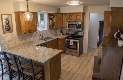 Sunset Heights House | Gorgeous island-themed retreat sleeps up to 30 in Orem, UT!