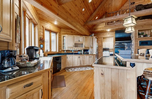 Three Lakes House | Gorgeous lakefront lodge with dock, deck, game room & firepit