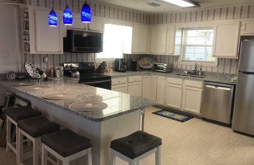 Silver Cay House | Home on water w/boat dock. 3 bed, 3 bath. Sleeps 9. Sunsets, beaches, fishing.