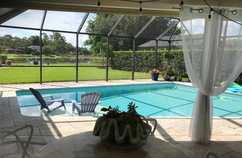 Kings Lake House | In the Heart of Naples, Suite with Lake & Pool