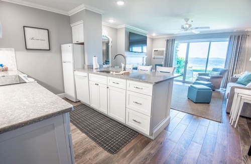 Boyne City Condo | Lake Charlevoix Views | Private Patio | Steps to Sand & Shoreline |