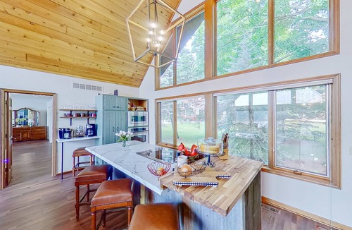 Paw Paw House | Lakefront home with spacious decks, lake views, hot tub, gas grill, & W/D