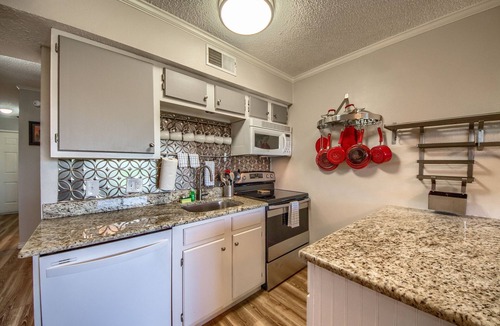 New Braunfels Condo | Located right on the Comal River! Pool, hot tub and direct river access!