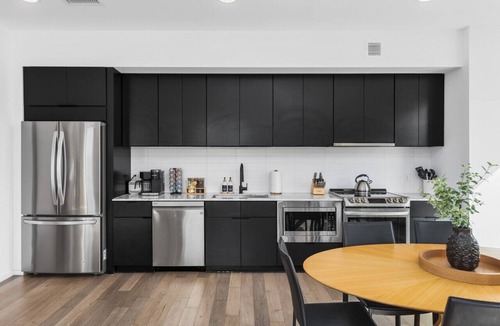 North Capitol Apartment | Luxury on the River - Walk to Downtown, 2 Private Patios & Garage Parking