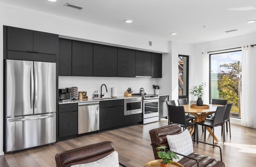 North Capitol Apartment | Luxury on the River - Walk to Downtown, 2 Private Patios & Garage Parking
