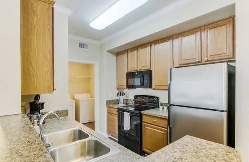 The Colony Apartment | Minutes from Grandscape! Pool, Hot Tub & Gym – Close to The Star & Top Golf!