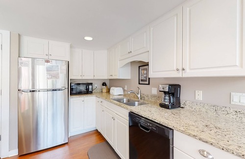 Shipyard Plantation Condo | Modern, light-filled villa with 2 living areas, pool, easy beach access, & patio