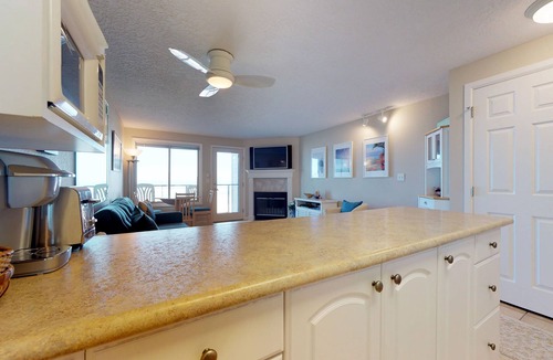 Rockaway Beach Condo | Oceanfront condo with a full kitchen, balcony, & sweeping sea views