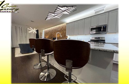 Durham House | Oceanna Drive a TESLA during your all-inclusive stay!