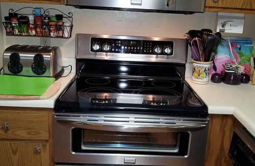 Lake Ozark Condo | Palm Tree Paradise Lakefront Condo Sleeps 6 Adults With King Bed & 2 Queen Beds