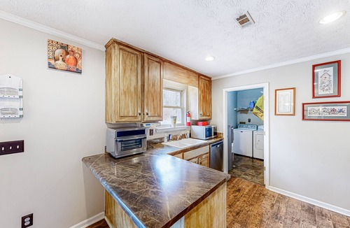 Green Pond House | Peaceful home with custom front porch near University of Alabama, dog-friendly
