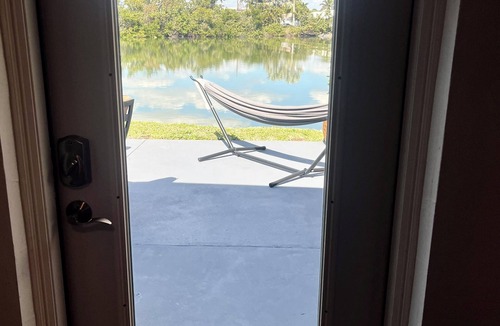 Isles of Capri Apartment | Peaceful Waterfront Efficiency~Dolphins, Manatees and Island Vibes