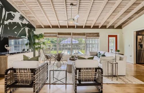 Parrot Cove House | Peacock Oasis - Retro Vibes and Poolside Lounging in Parrot Cove