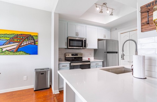 Shepherd Mountain Condo | Recently Remodeled Top Floor Condo W/Great Hill Country Views & Private Garage!