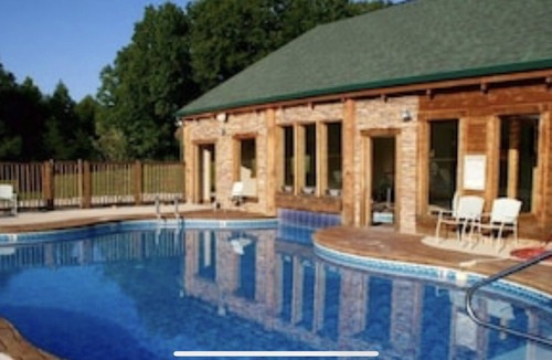 Spencer Cabin | Recline in the room in front of the fireplace with your PET