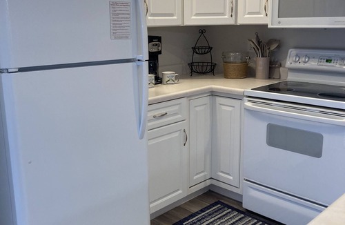 Camdenton Condo | Relax on your screened in balcony overlooking the Lake. Two Golf Courses nearby.