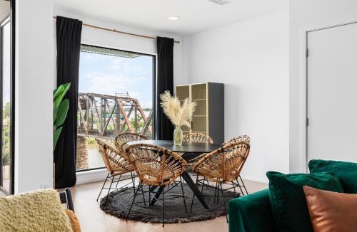 North Capitol House | River View High-End Condo with Private Patio and FREE Parking
