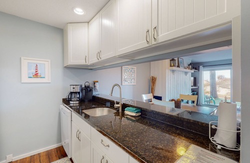 Maple City Condo | Riverview condo near the lake with beach access, fireplace, patio & cable