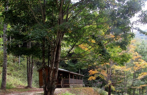 Hot Springs Cabin | Romantic Pet Log Cabin with hot tub, waterfall, wifi, gas grill, firepit creek