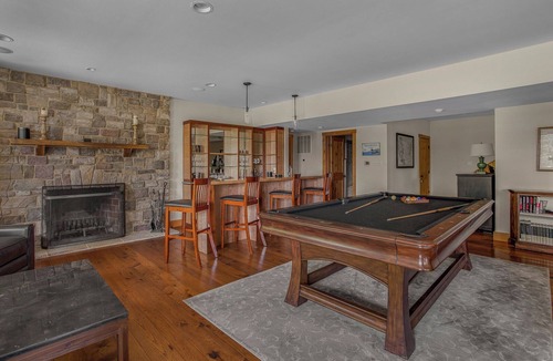 Huntly House | Secluded 4 bedroom log style home with screened porches, deck and fishing pond.