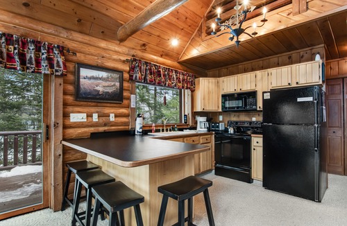 Presque Isle Cabin | Spacious and beautiful lakefront log home on 7 acres with private dock