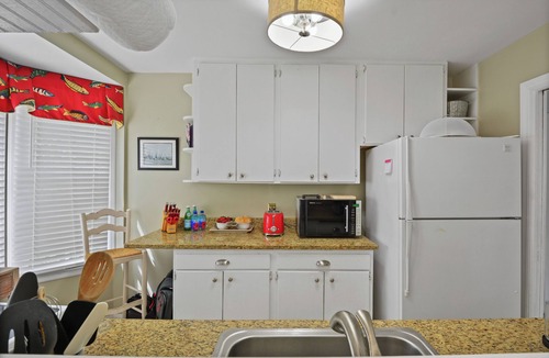 Kings Terrace House | St. Simons Island Walkable Beach Days Fire Pit Nights Fenced Yard