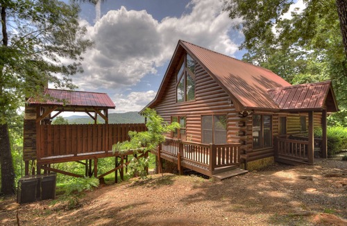 Ellijay Cabin | Sunset Ridge - Pet-friendly retreat boasts panoramic mountain views, oversized deck with hot tub, grand outdoor fireplace, captivating sunsets, and WiFi