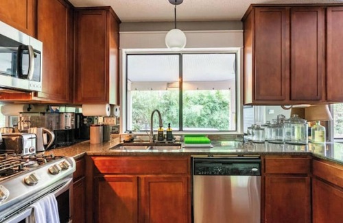 Los Indios House | Tranquil Family Retreat in NW Austin, Hot Tub, Office, & Backyard Escape