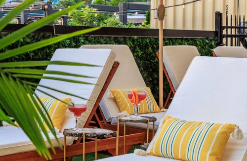 East Cesar Chavez House | Units 1+2 Inn Cahoots on 6th: 10BR/26Bed - Pool,Roofdeck, Garden Bars, Walk To Everything!