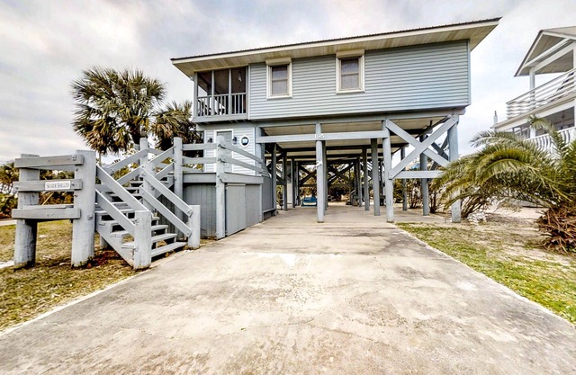 Dog-friendly home - steps from the beach with screened porch