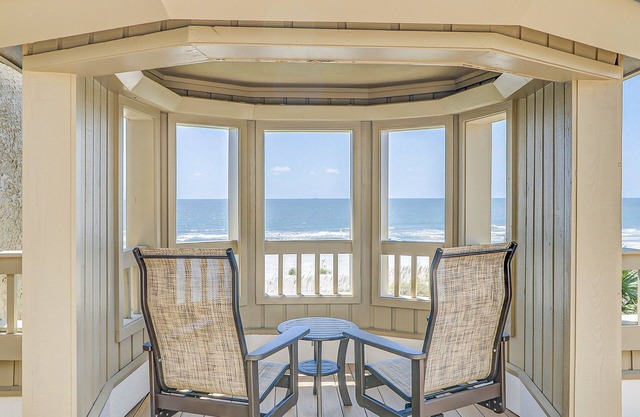 Grand oceanfront getaway with a sundeck, pools & beach access