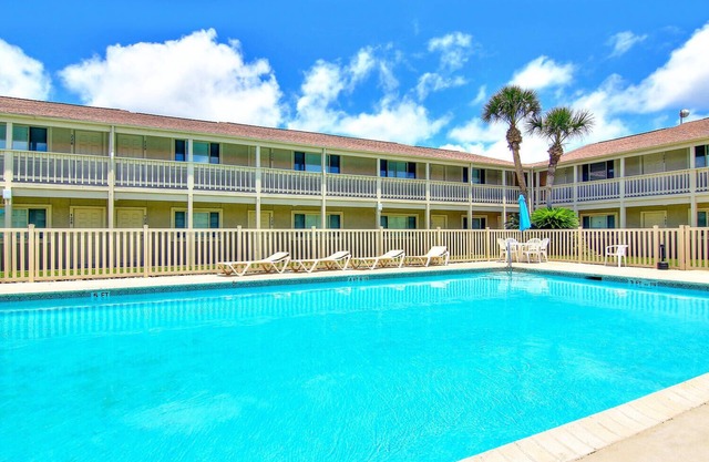 Located right by the large heated pool. Only a block to the beach!