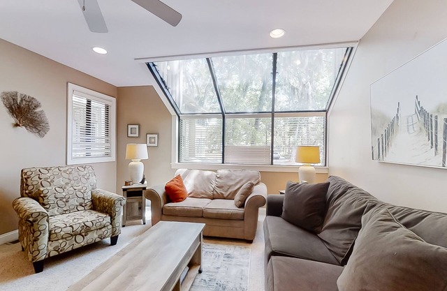 Modern, light-filled villa with 2 living areas, pool, easy beach access, & patio