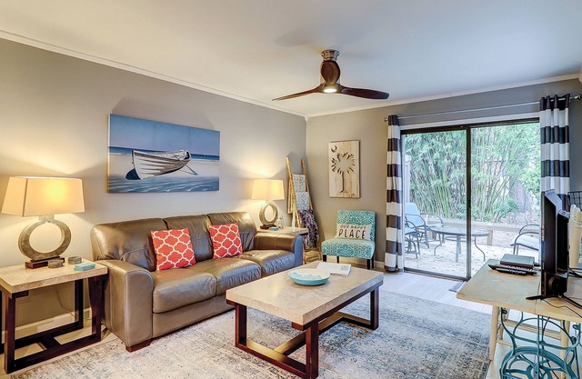 Updated condo with patio, shared pool, and WiFi - walk to Folly Field Beach Park
