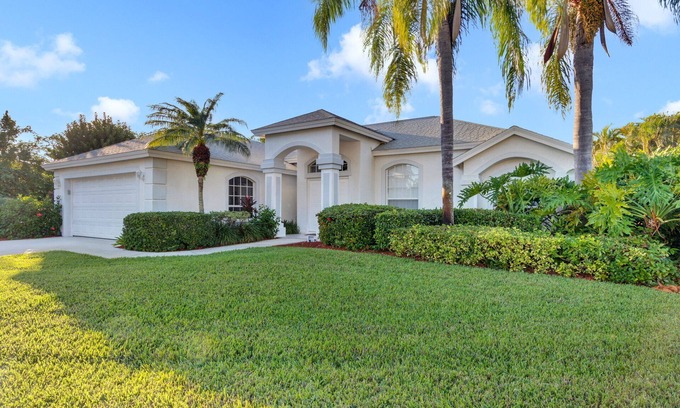 Central Naples House | Light and Bright describes this 3/2 Pool home with long beautiful lake views