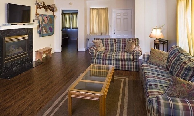 Pigeon Forge Condo | Little Pigeon River 508 2BD Condo with Fireplace and Jacuzzi Tub by RedAwning
