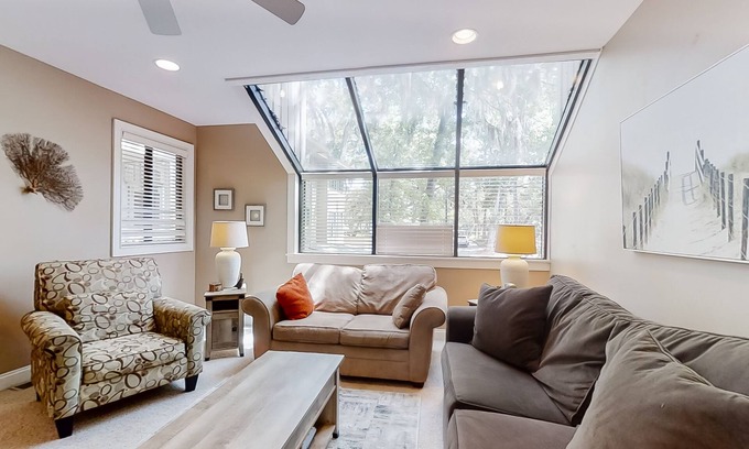 Shipyard Plantation Condo | Modern, light-filled villa with 2 living areas, pool, easy beach access, & patio