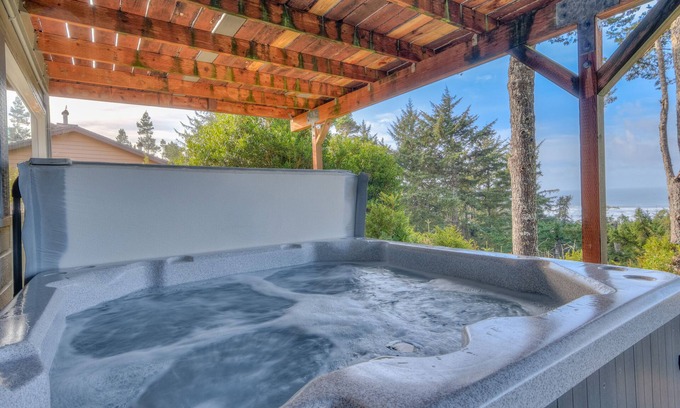 Sandpiper Village House | Stupendous Views Over Forest to Sea, Hot Tub, and game room in This Family Home!