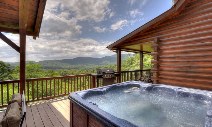Ellijay Cabin | Sunset Ridge - Pet-friendly retreat boasts panoramic mountain views, oversized deck with hot tub, grand outdoor fireplace, captivating sunsets, and WiFi